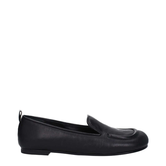 Premiata Black Leather Slip-On Loafers with round toe and low flat heel, featuring a back logo, shown from the side.