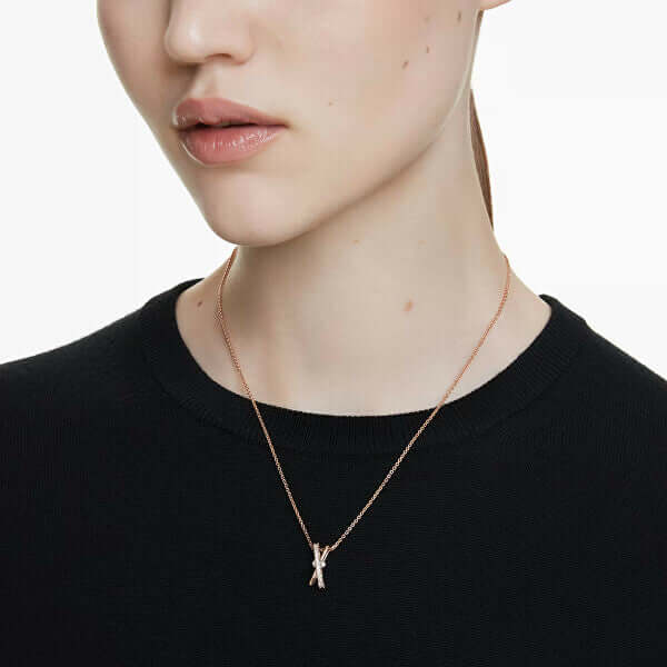 SWAROVSKI Mod. 5689788 Hyperbola Pendant Necklace on model, rose gold-tone, white zirconia, twisted bands