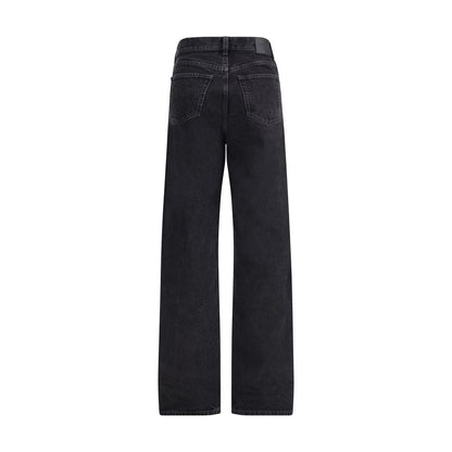 Back view of Saint Laurent Black Cotton Slim Fit Jeans with leather jacron and V waist design for modern silhouette.