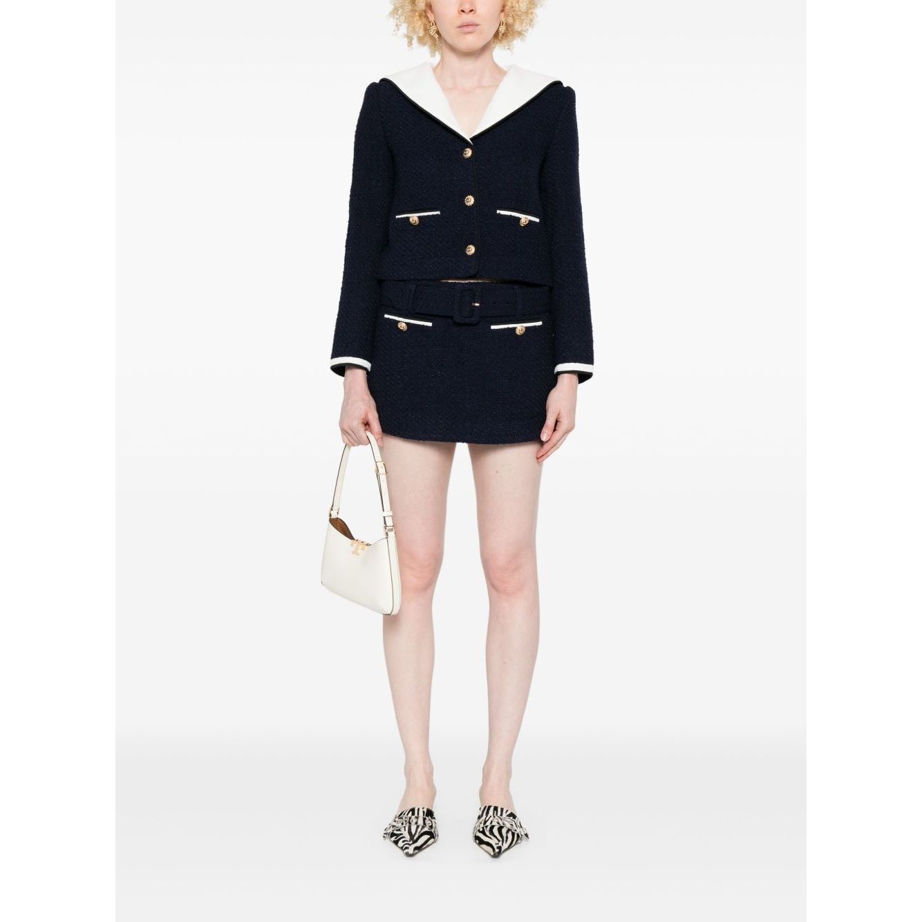 Self-portrait Jackets Blue - navy blue bouclé short jacket with stripe trim, contrasting collar, and welt pockets, modeled with white handbag.