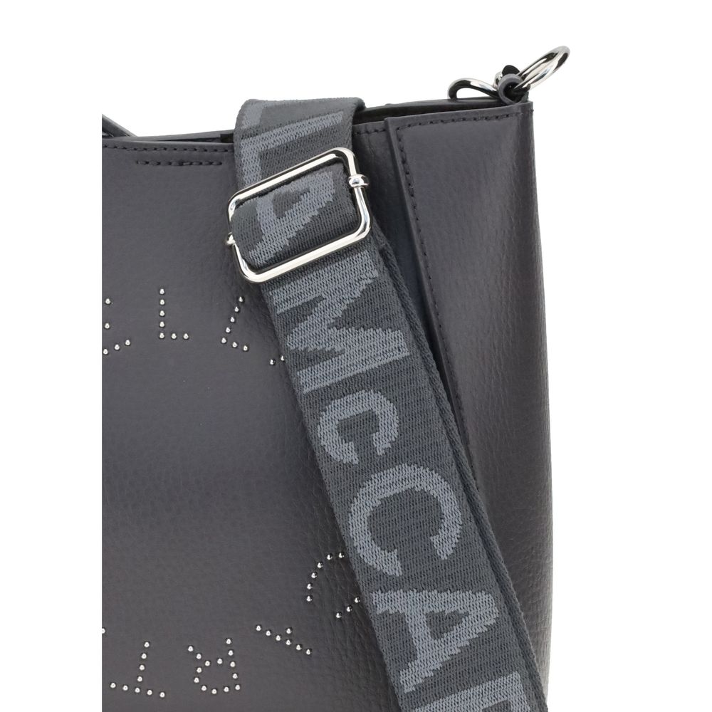 Close-up of Stella McCartney Logo Shoulder Bag featuring logo detail and adjustable strap with topstitching on sustainable material.