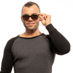 Man wearing Sting Black Men Sunglass with black plastic frame and grey lenses, offering 100% UVA & UVB protection, stylishly posed.