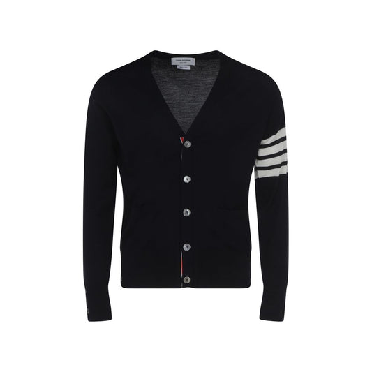 Thom Browne Cardigan with striped cuffs, button closure, V-neck, and brand logo on sleeve, made of 100% fleece wool.