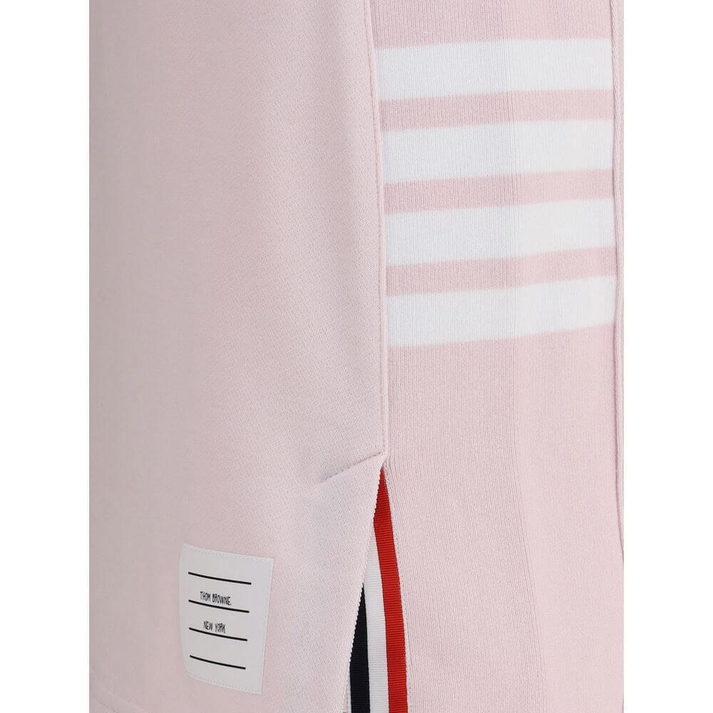 Thom Browne Multicolor Cotton Mini Skirt with front slits and logo patch, featuring iconic multicolored bands. Made in Japan, 100% cotton.