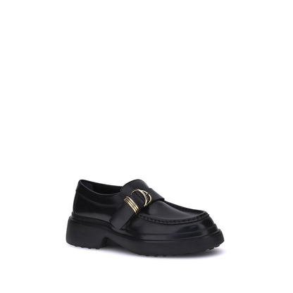Tod's Black Rubber Platform Loafers with metal rings and nappa leather for a timeless and elegant style.