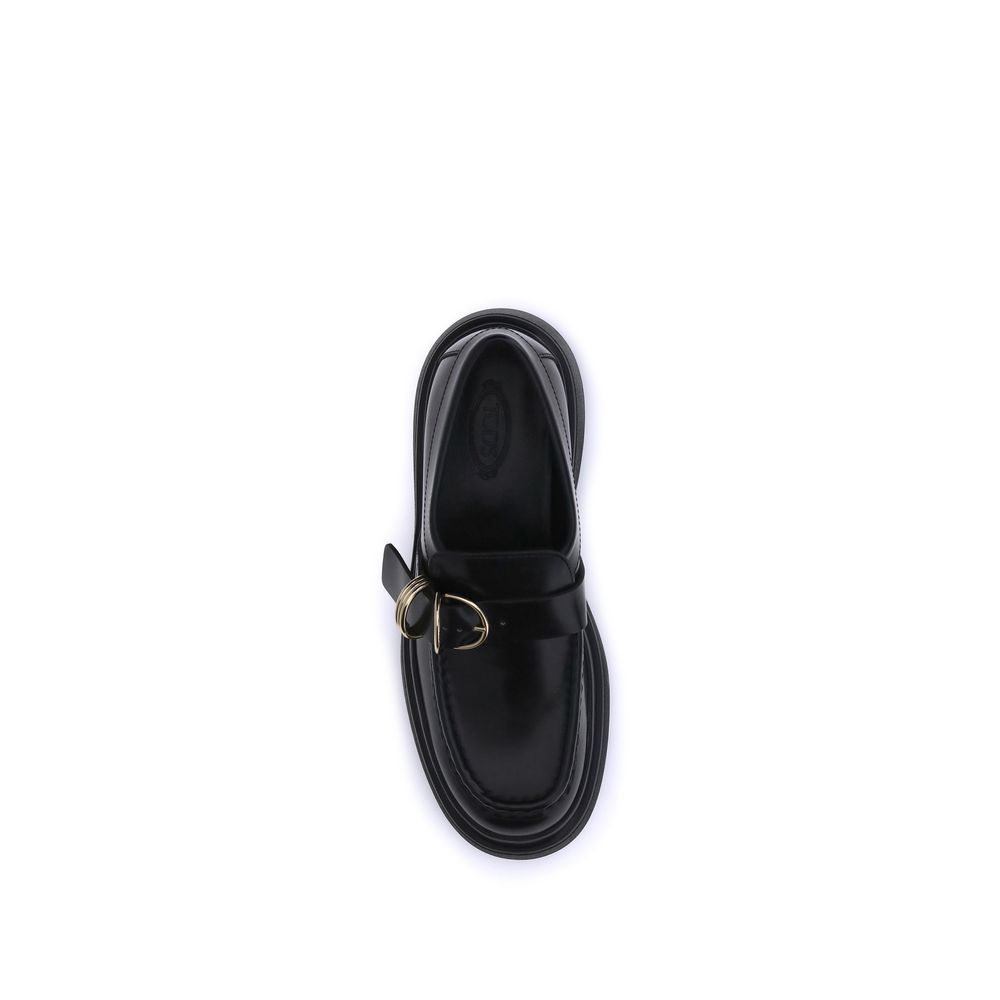 Top view of Tod's Black Rubber Platform Loafers with nappa leather and metal rings embellishment, showcasing timeless elegance and style.