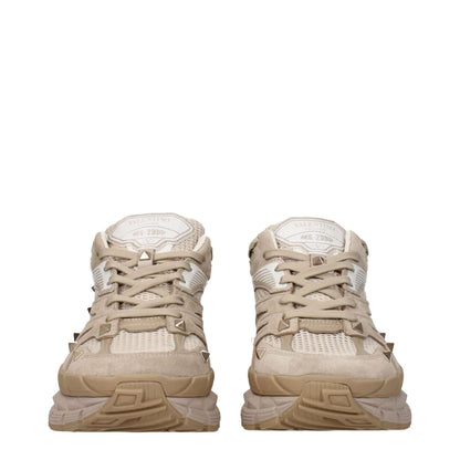 Valentino Garavani Beige Fabric Low Top Sneakers with front and back logos, studs, and lace-up closure, rubber sole, round toe.