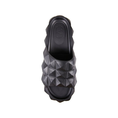 Valentino Garavani Black Rubber Slippers with all-over rubber studs, open toe, round toe, and Italian craftsmanship for men.