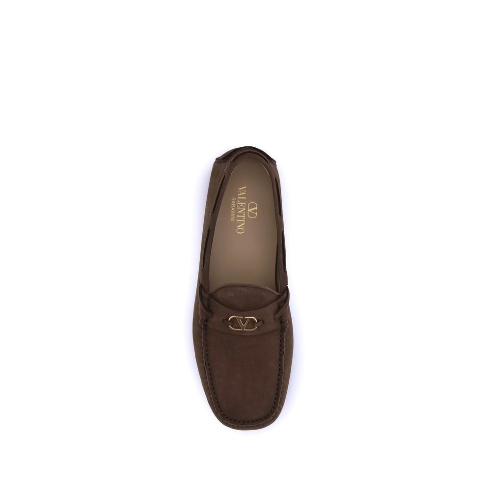 Top view of Valentino Garavani Brown Rubber Slip-On Loafers with VLogo plaque and notched rubber sole.
