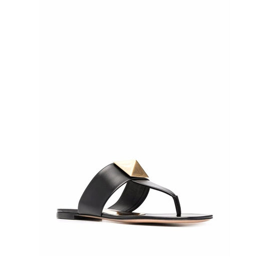 Valentino Garavani One Stud sandals in black leather with gold stud, featuring a thong strap and round toe, made in Italy for women.