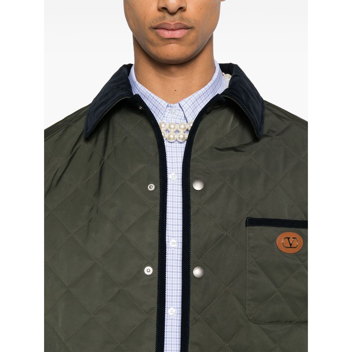 Olive green Valentino Vlogo Signature quilted jacket with contrasting collar and patches.