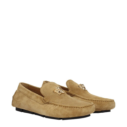 Versace Beige Leather Slip-On Loafers with gold front logo, suede material, round toe, and low flat heel.
