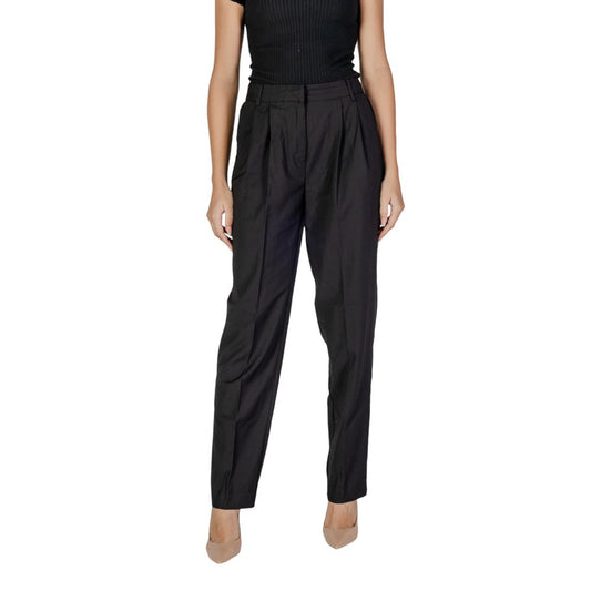 Woman wearing Vila Clothes Black Polyester Pant with high waist and front pleats, showcasing comfort and style in elegant black.