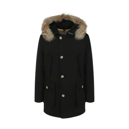 Woolrich Black Cotton Parka with fur hood, featuring patch pockets, ribbed cuffs, and oversized fit, ideal for AW25 season.
