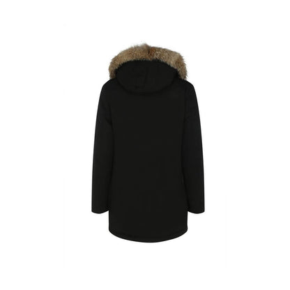 Back view of Woolrich Black Cotton Parka with fur-trimmed hood and oversized design, featuring a padded winter jacket ideal for AW25 season.