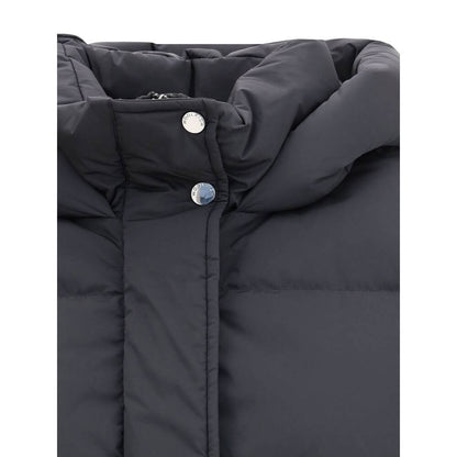 Close-up of Woolrich Black Goose Down Coat with hood, button closure, and quilted design for warmth and comfort.