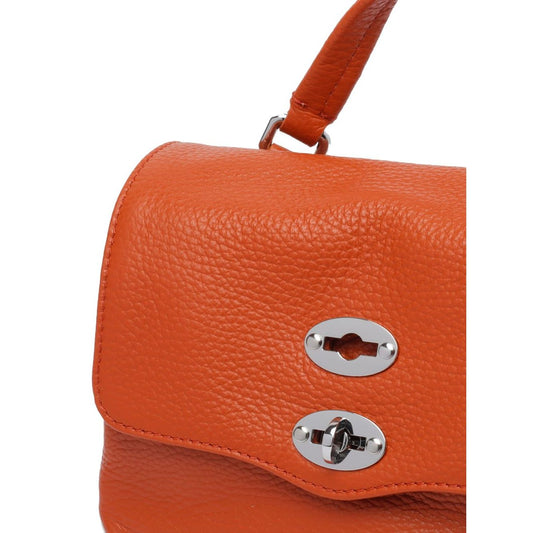 Zanellato Postina Daily Baby leather handbag in orange calf leather with turn-lock closure and stud detailing, top handle visible.