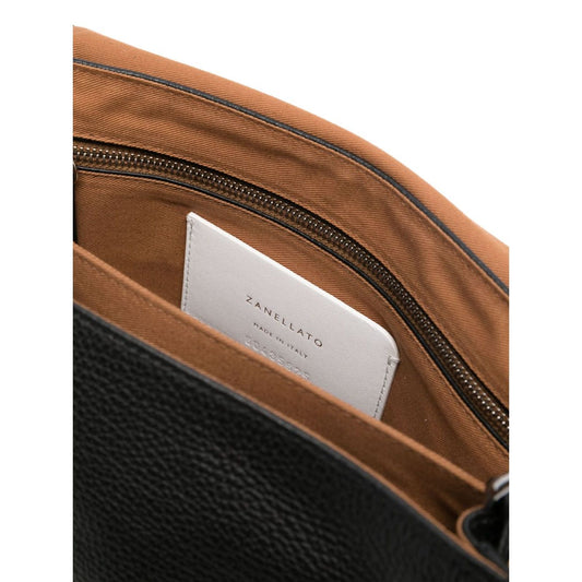 Interior of Zanellato Postina Daily medium leather handbag highlighting zip pocket and logo.
